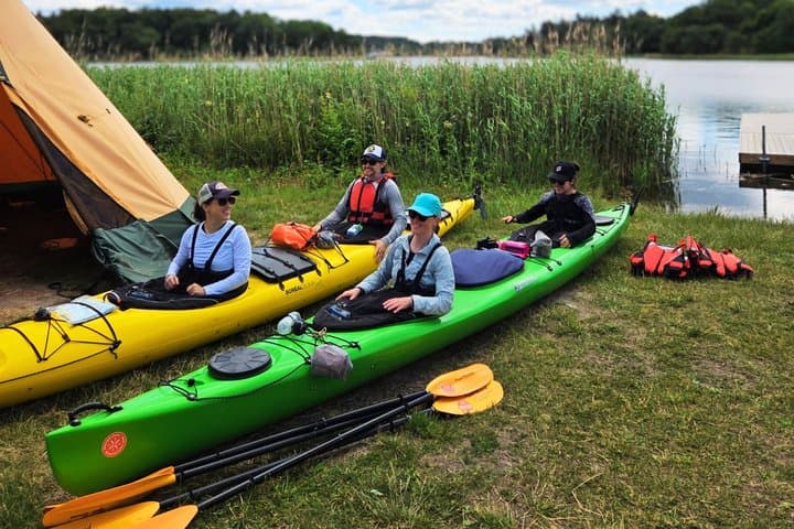 Small-group start and safety briefing for the 2-day guided kayak tour — stable sea kayaks and beginner-friendly instruction.