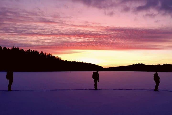Early sunset over snow covered lake