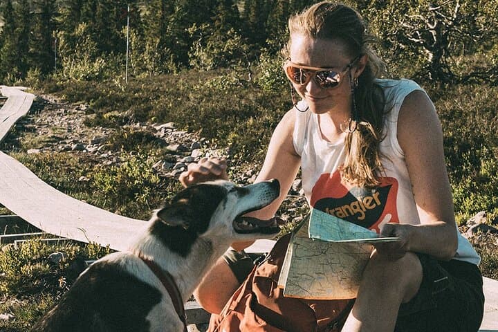 Mountain walk with husky companion