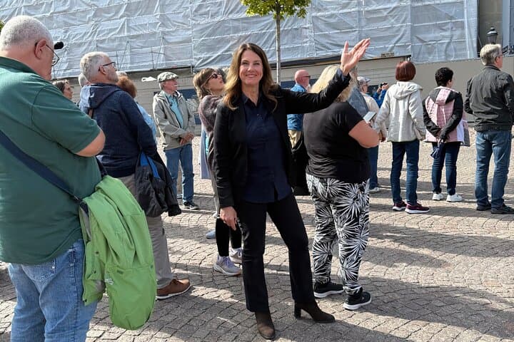 Our guide outside the Royal Palace, sharing insights about the building’s history and current restoration.